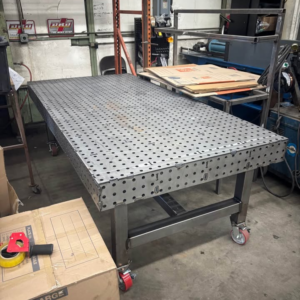 Finished Datum steel welding fixture table with perforated top and locking casters