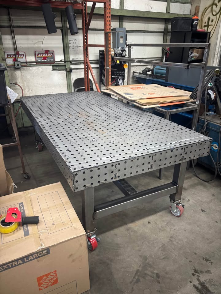 Finished Datum steel welding fixture table with perforated top and locking casters